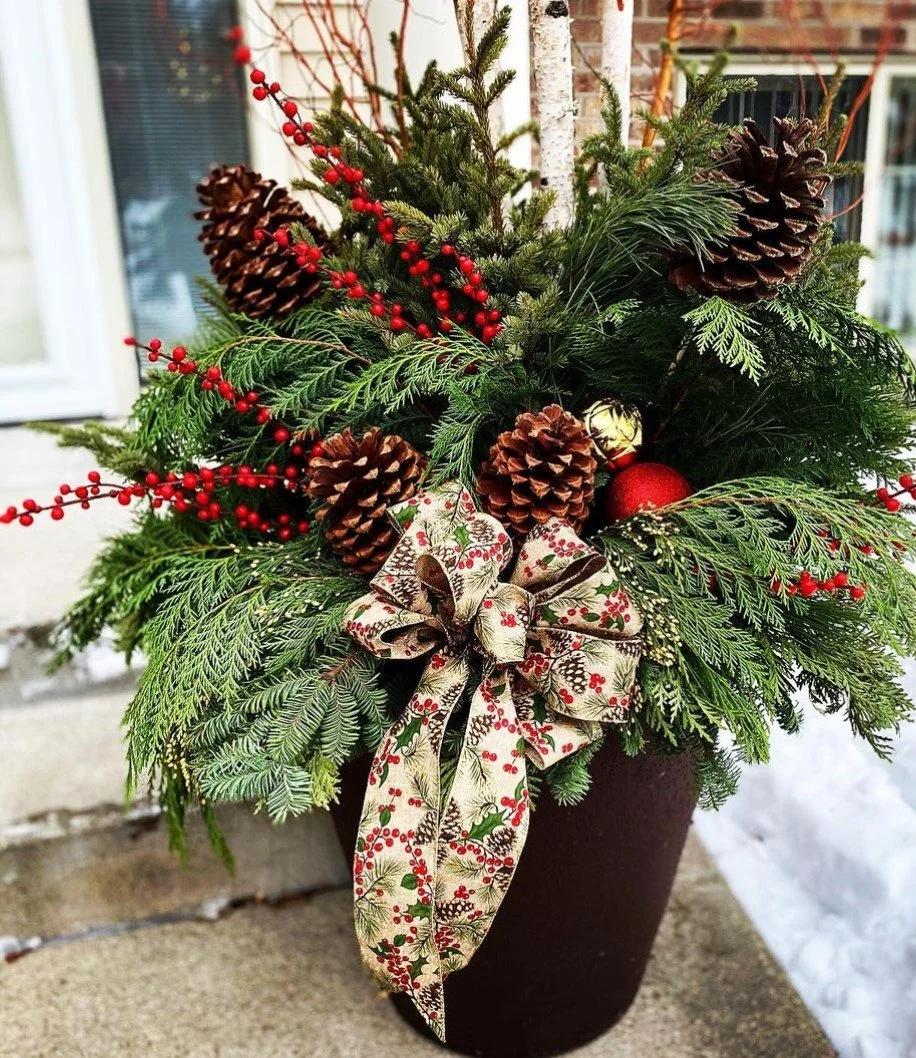 Holiday themed winter planter display