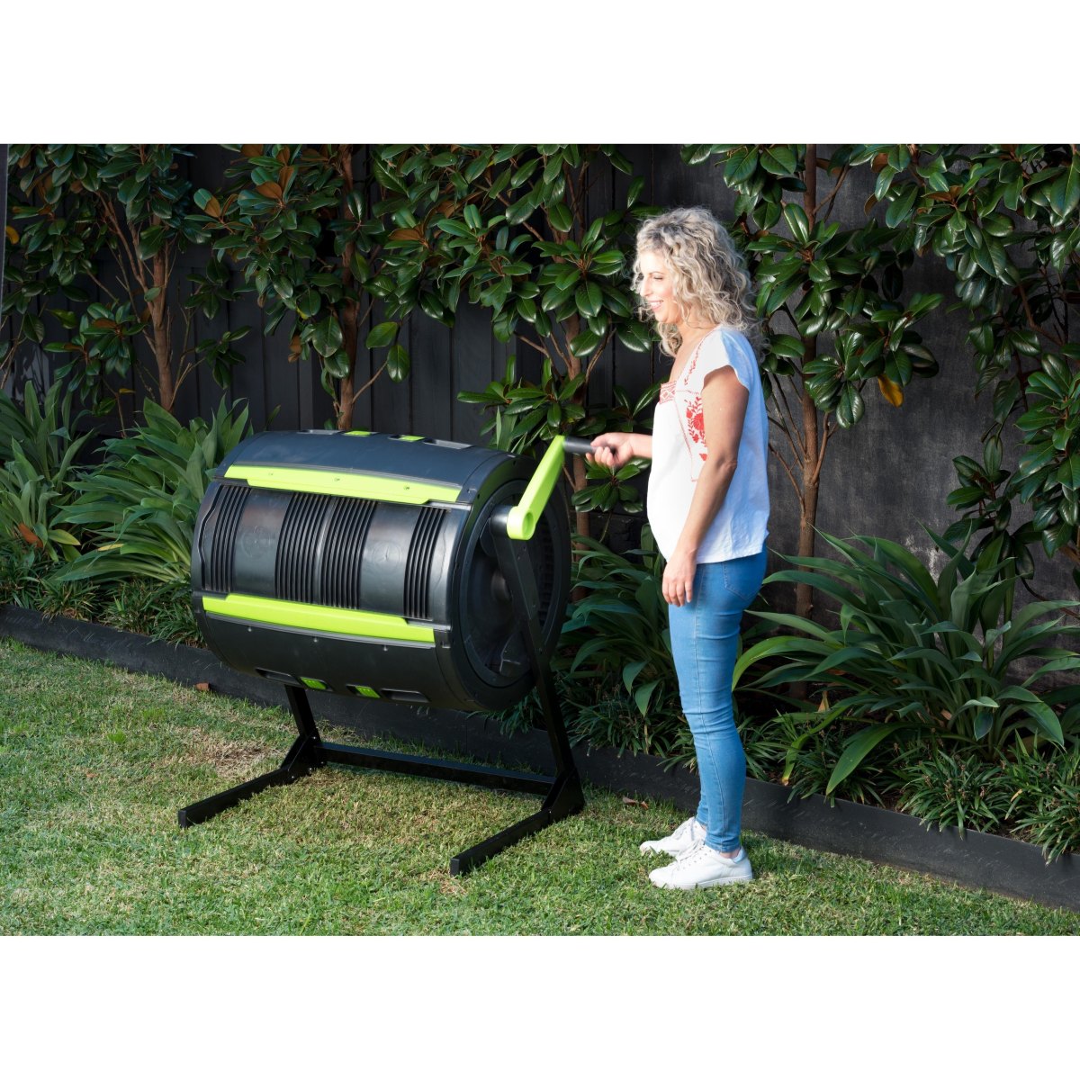 Rotating drum compost system outdoors